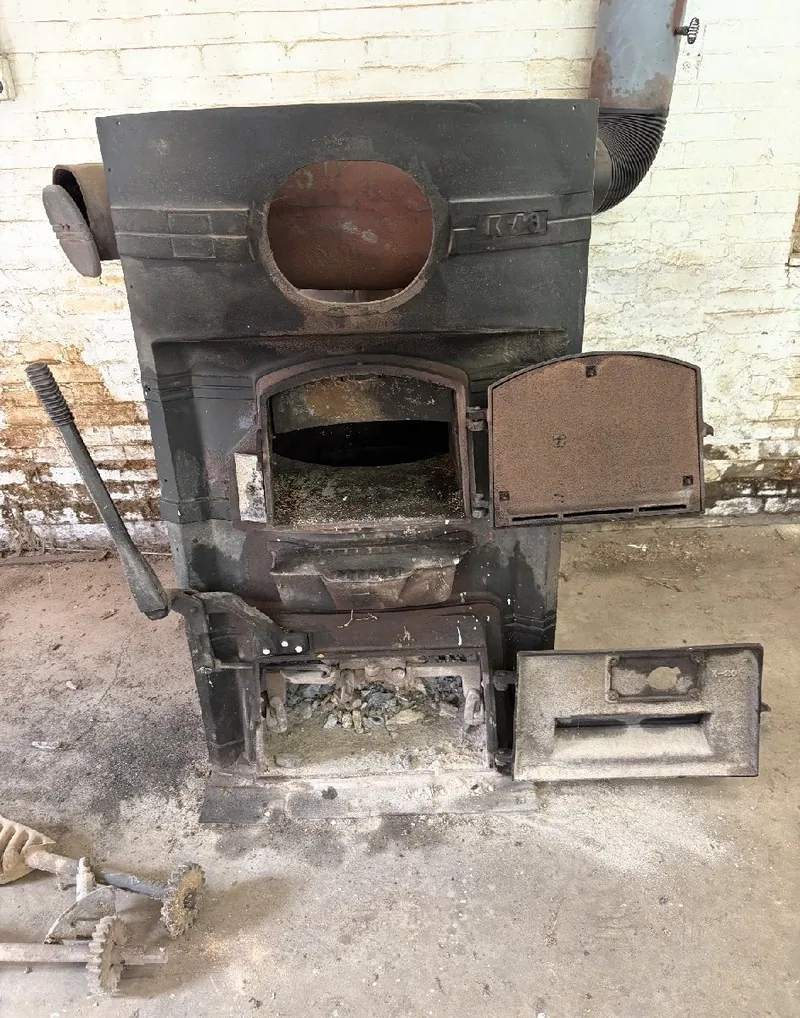 Vintage Mueller cast iron coal stove